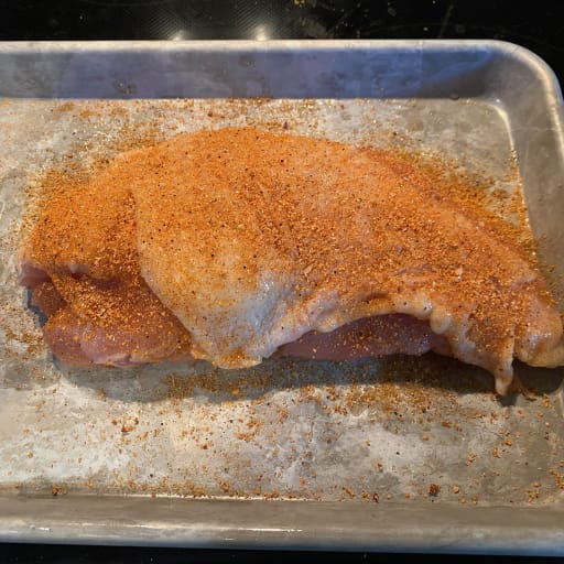 Seasoned Turkey Breast skin side up.